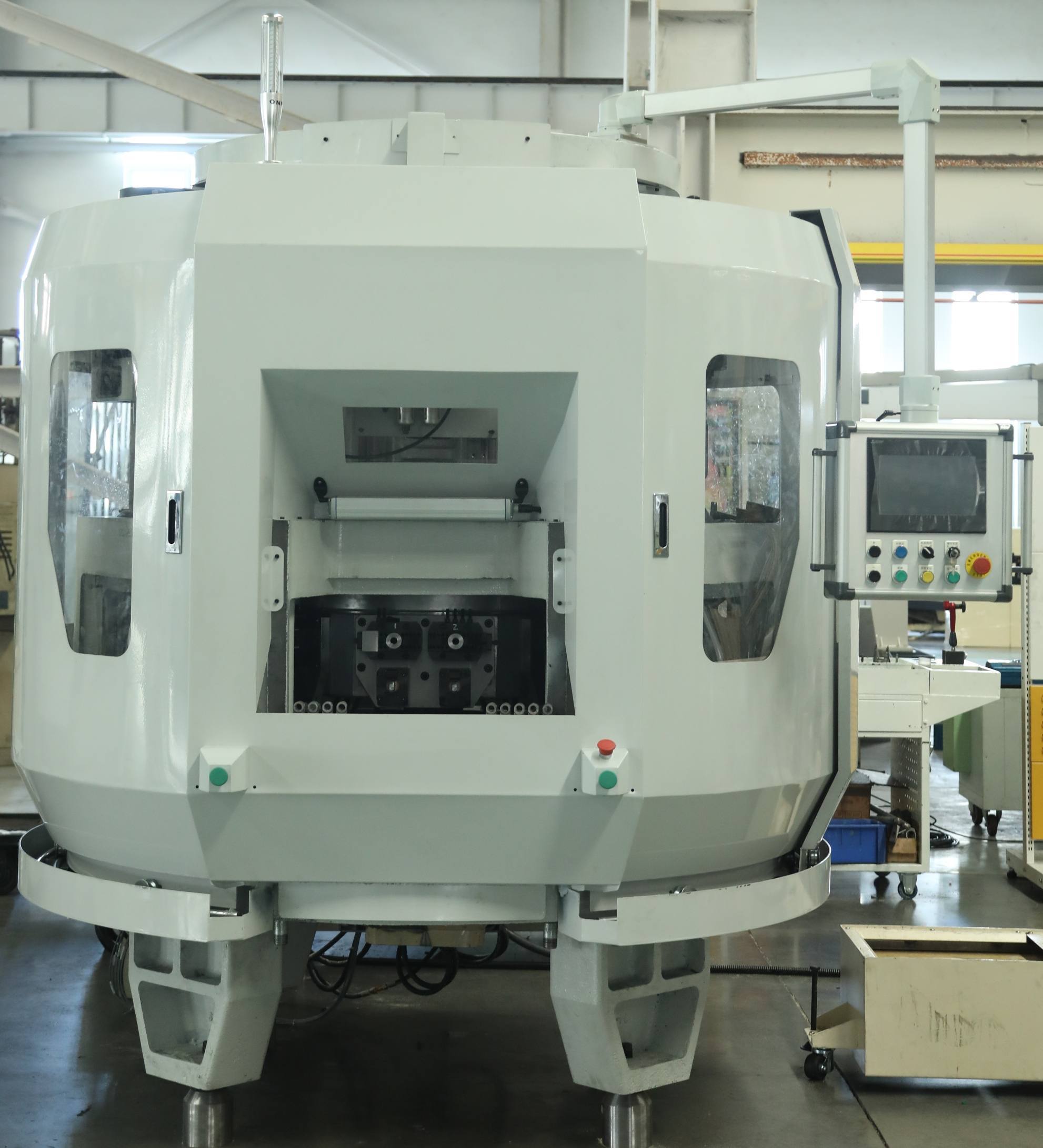 Multi-station machining machine for automotive steering knuckle forks